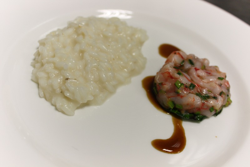 risotto mantecato con crema di limoni e carpaccio di gamberi con salsa alla liquirizia