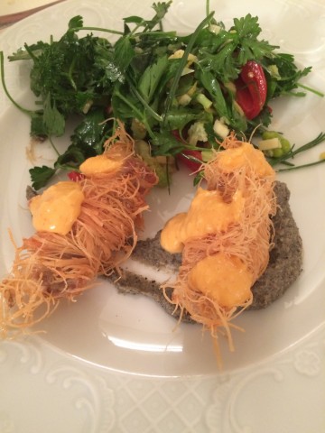 Kadaif wrapped fish in lemon sauce on eggplant cream and green salad