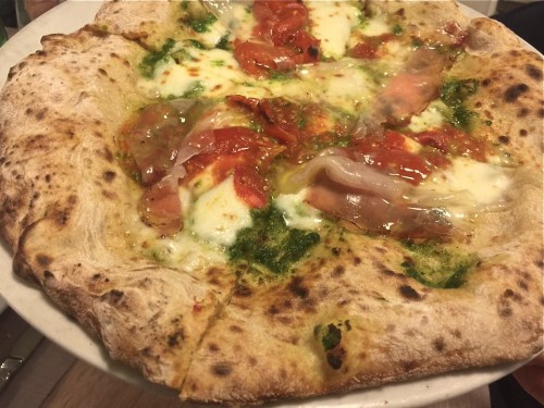 Germe di grano condita con pesto di rucola, fior di latte, pomodoro del piennolo, lonzarda di suino razza casertana