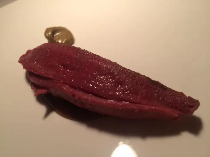 Reale di Niko Romito, piccione fondente e pistacchio