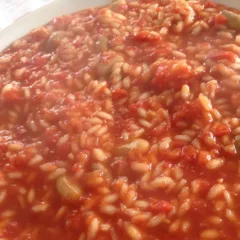 Risotto cotto nel pomodoro e fagioli borlotti