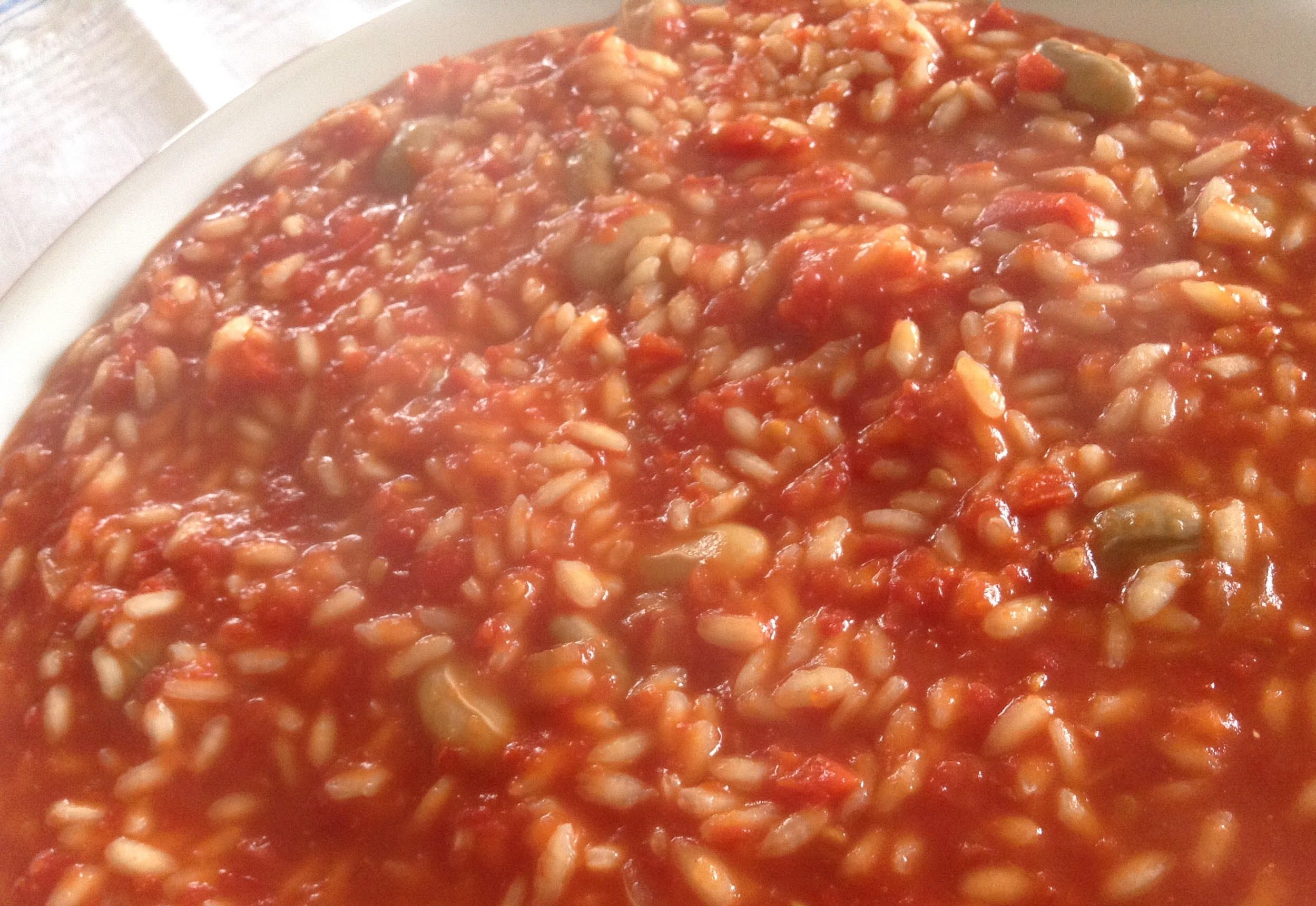 Risotto cotto nel pomodoro e fagioli borlotti