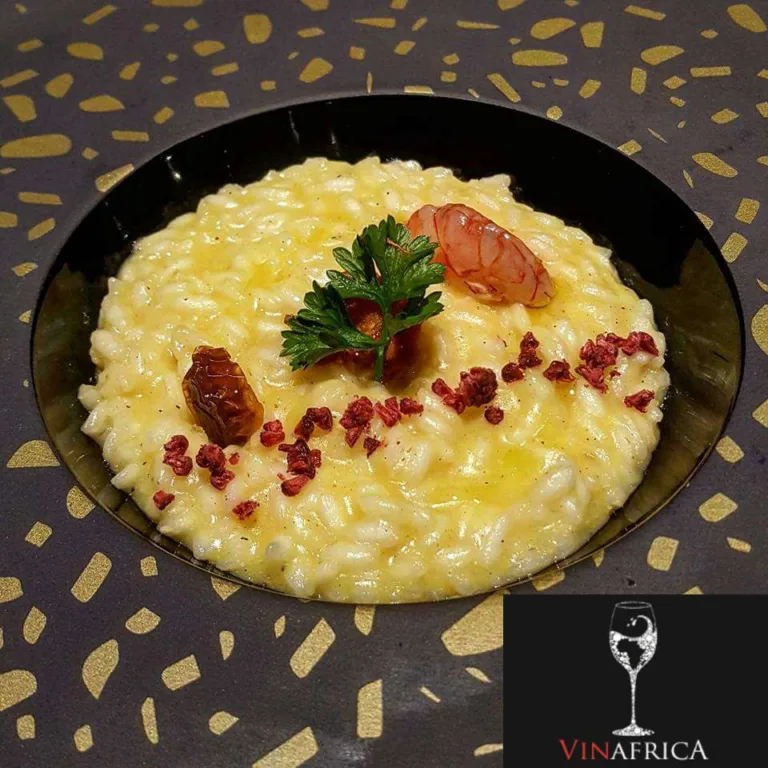 Risotto in Giallo Crema di pomodorino giallo e limone, riccio di mare, gambero rosso e lampone