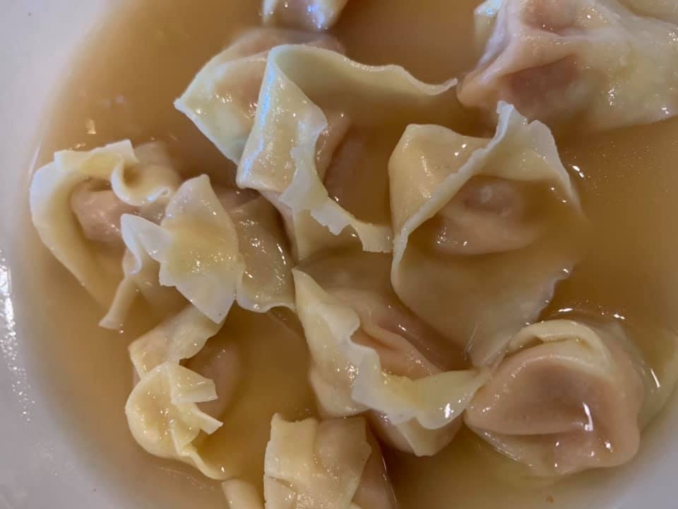 Trattoria Nu. Brodo di rosmarino e allora e buccia di limone con pasta ripiena di melassa di frutta, balsamico e parmigiano