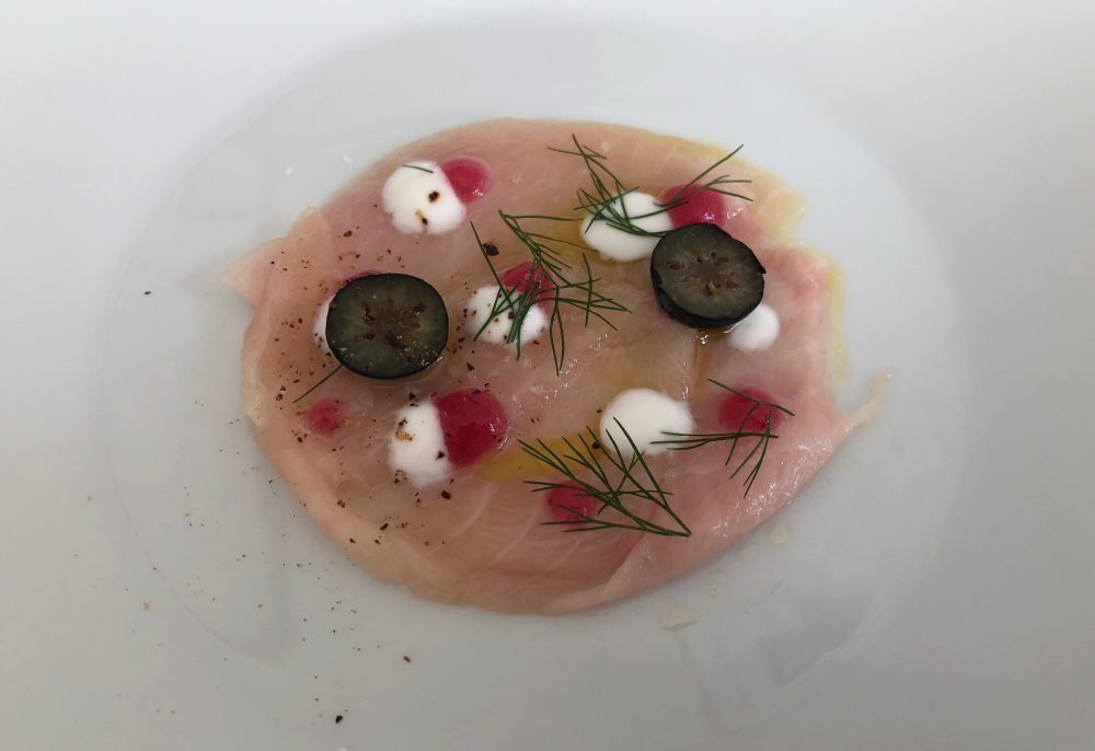 Collina, carpaccio di salmerino trentino e melograno