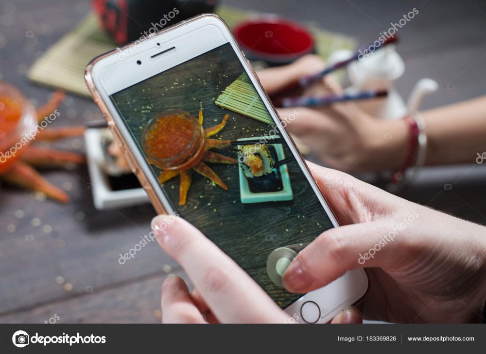 Instagram photographer blogging workshop concept. Hand holding