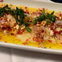 Taverna Kerkyra-Carpaccio di merluzzo marinato in succo d'arancia con torroncino igp di Bagnara